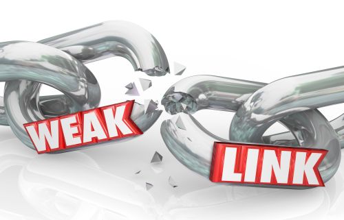 Weak Link words on broken chain links to illustrate a bad or poor performer that leads to failure in an organization, business or company